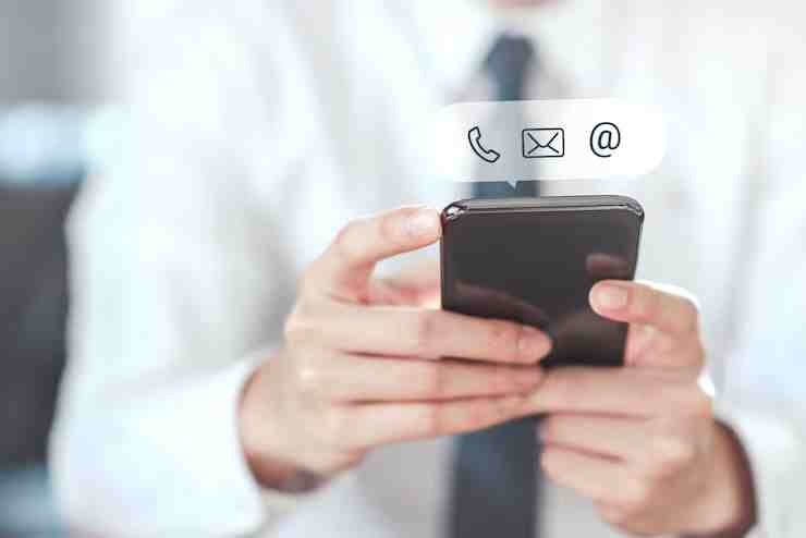 contact-us-hand-holding-mobile